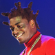 Illustration for article titled Happy Kodak Black Successfully Sits Through Soft-ball Interview from the Breakfast Club